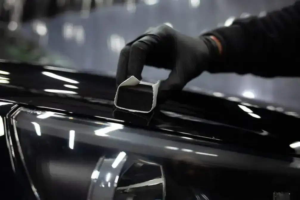 Professional ceramic coating work in detailing studio